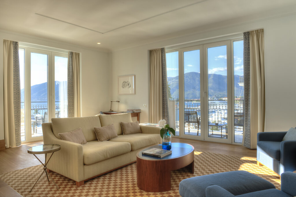 Bright suite living area with floor-to-ceiling windows and Boka Bay views at Regent Porto Montenegro.