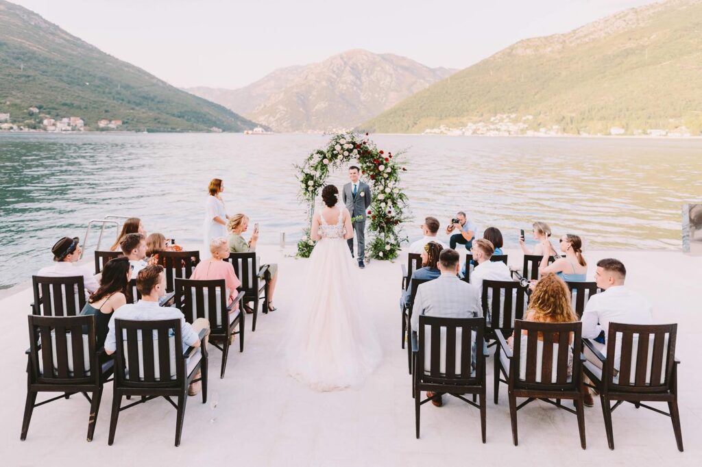 Wedding ceremony by the water at Adriatica Restaurant & Beach Club in Kamenari, Boka Bay, Montenegro.