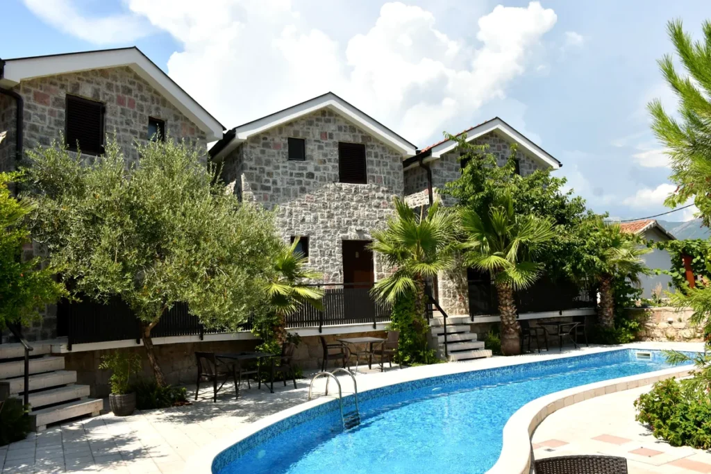 Swimming pool and stone villa accommodation at Forte Rose in Rose, Luštica Peninsula, Montenegro.