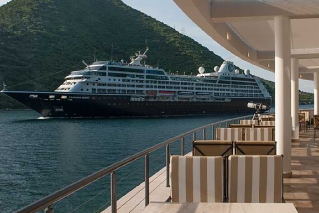 Cruise ship passing through Boka Bay near Kostanjica, seen from the Verige strait viewpoint. Caption: Boka Bay moments at the Verige strait.